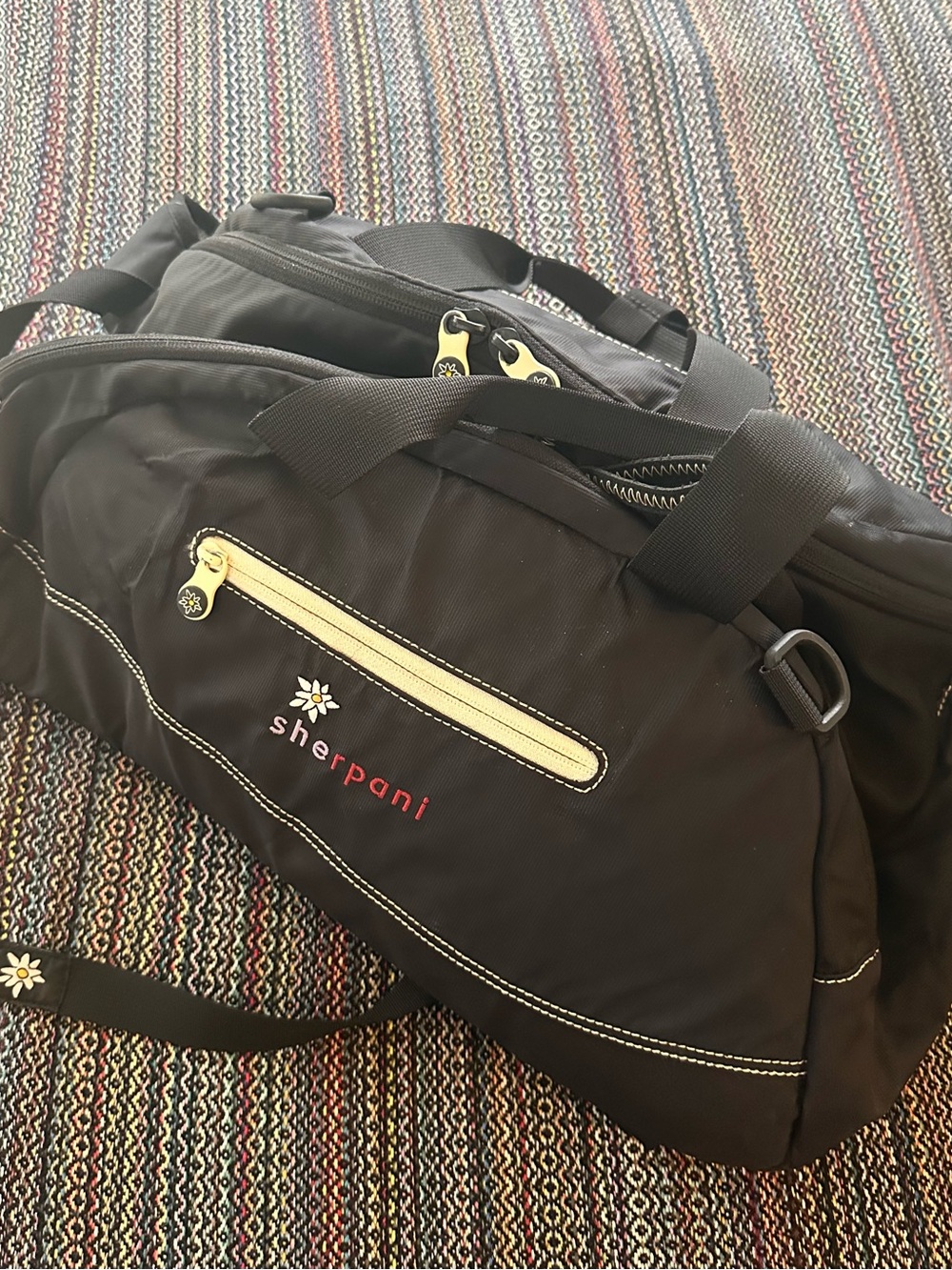 Sherpani Black Duffel Bag with Cream Accents